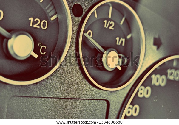 Car Dashboard. The fuel gauge, temperature
gauge and tachometer.