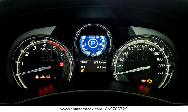 Car dashboard have a Speed meter, Tachometer,\
Temperature meter, Fuel indicator, Trip mile meter, Seat-belt\
warning light, Turn signal indicator, Door open warning light,\
Battery warning light