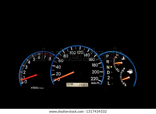 Car dashboard\
indicators on black panel