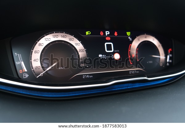Car dashboard interior view. Car instrument panel\
with tachometer and speedometer.  Car engine indicator. Selective\
focus area.