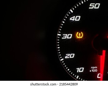 Car dashboard panel icon on a black background. Tire pressure monitoring. - Shutterstock ID 2185442809