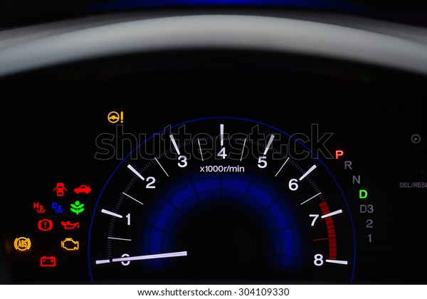 Car dashboard panel\
indicators, yellow red green blue icons of engine, petrol, air bag,\
air conditioning, speedometer, oil level and other colourful car\
maintenance signs.