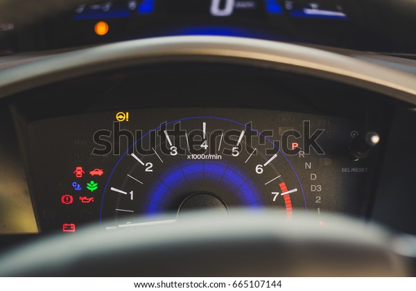 Car dashboard panel\
indicators, yellow red green blue icons of engine, petrol, air bag,\
air conditioning, speedometer, oil level and other colourful car\
maintenance signs.