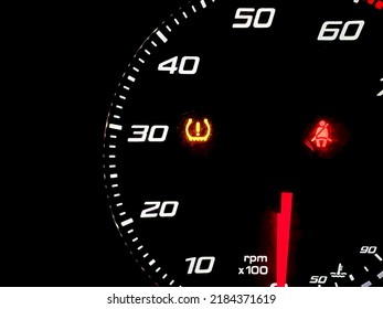 car dashboard panel with light signal the belt is not fastened and the tire pressure is low. car safety concept, travel, vacation. vehicle check and control. - Shutterstock ID 2184371619