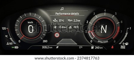 Car dashboard panel with speedometer, odometer, tachometer, fuel gauge and turbo boost pressure indicator. Modern LCD instrument cluster in sport car. Performance details.