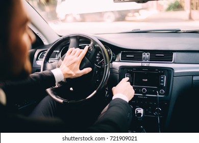 Car Dashboard. Radio Closeup. Man Sets Radio