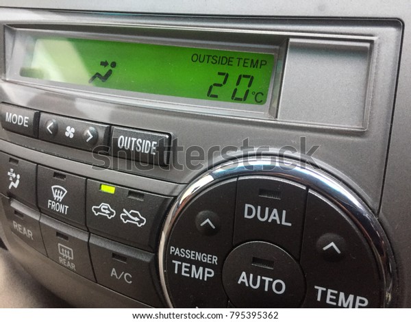 Car dashboard shown outside temperature of 20-21\
degree celcius.