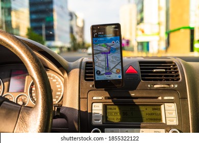 In Car Dashboard View With Smartphone Showing Police On Waze Maps. Driver Using Waze Maps In Bucharest, Romania, 2020