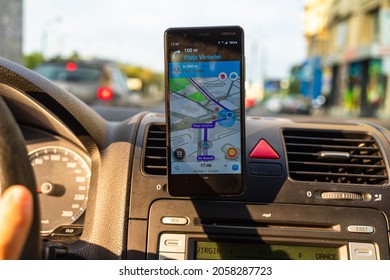 In Car Dashboard View With Smartphone Showing Police On Waze Maps. Driver Using Waze Maps In Bucharest, Romania, 2020