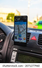 In Car Dashboard View With Smartphone Showing Police On Waze Maps. Driver Using Waze Maps In Bucharest, Romania, 2020