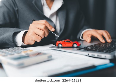 Car dealer business woman signing car insurance document or lease paper. Planning to manage transportation finance costs. Concept of car insurance business, saving buy with tax and loan for new car. - Powered by Shutterstock