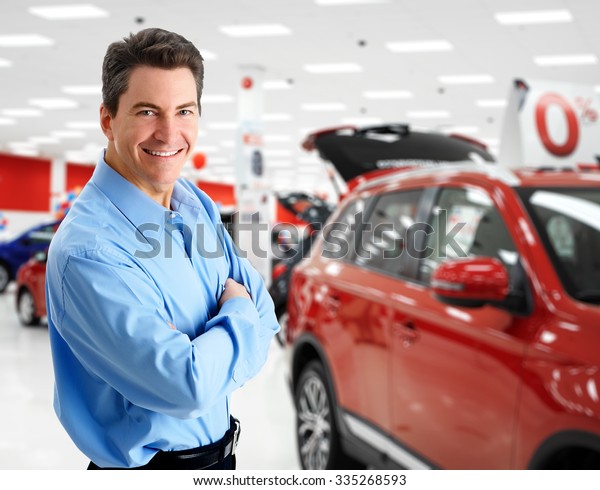 Car dealer man. Auto dealership and rental
concept background.