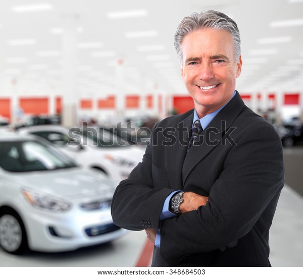 Car dealer man. Auto dealership and rental\
concept background.