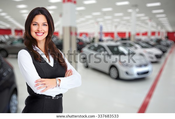 Car dealer woman. Auto dealership and rental
concept background.