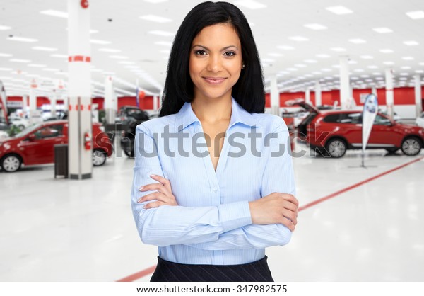 Car dealer woman. Auto dealership and rental\
concept background.