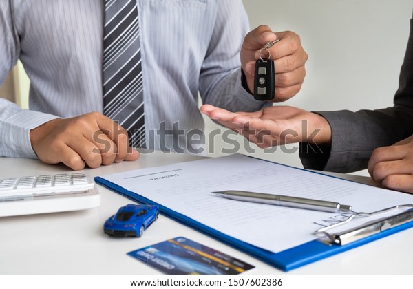 Car dealership provides advice about insurance\
details and car rental information and delivers the keys after\
signing the rental\
contract.