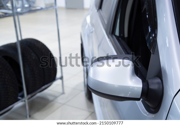 Car\
dealership. Car sales.The car is in the\
showroom.