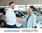 Car dealership, salesman or happy woman shaking hands for vehicle, finance agreement or purchase. Payment, smile or seller in showroom for good service, transportation business or automobile loan