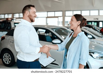 Car dealership, salesman or happy woman shaking hands for vehicle, finance agreement or purchase. Payment, smile or seller in showroom for good service, transportation business or automobile loan - Powered by Shutterstock