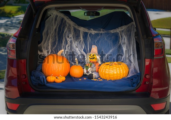 A car is decorated for Trunk or Treat event, an\
alternative for kids Trick or Treating in a safe environment on\
Halloween night. 