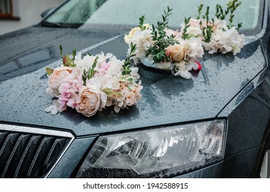 Car decoration for a wedding. Decorations on the car of the newlyweds. Cortege at the wedding