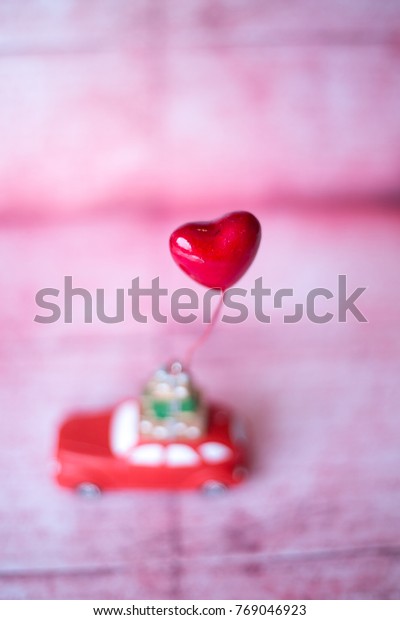 Car with\
decorative heart on vintage\
background