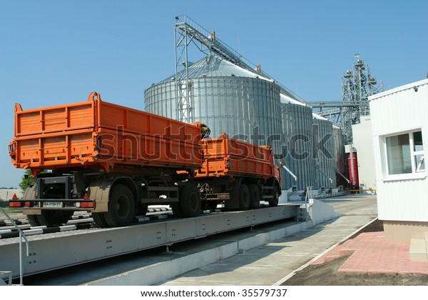 a car\
delivers a new crop of grain to\
storage
