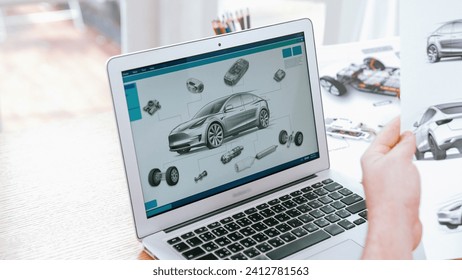 Car design engineer analyze car prototype for automobile business at home office. Automotive engineering designer carefully analyze, finding flaws and improvement for car design with laptop Synchronos
