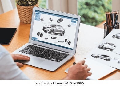 Car design engineer analyze car prototype for automobile business at home office. Automotive engineering designer carefully analyze, finding flaws and improvement for car design with laptop Synchronos - Powered by Shutterstock