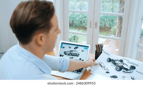 Car design engineer analyze car prototype for automobile business at home office. Automotive engineering designer carefully analyze, finding flaws and improvement for car design with laptop Synchronos