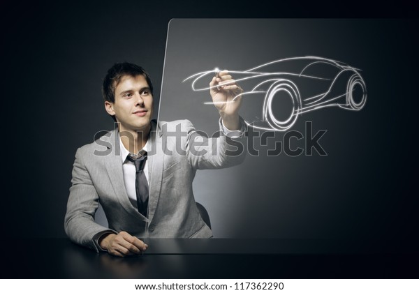Car designer draws his dream\
car