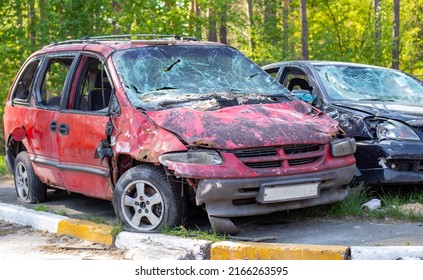 A car destroyed by shrapnel from a rocket that exploded nearby. Irpensky automobile cemetery. Consequences of the invasion of the Russian army in Ukraine. Destroyed civilian vehicle