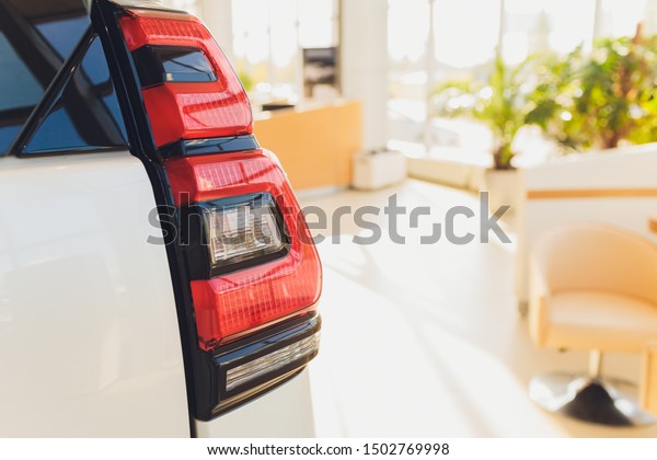 Car\
detail. New led taillight by night. The rear lights of the car, in\
hybrid sports car. Developed Car\'s rear brake\
light.