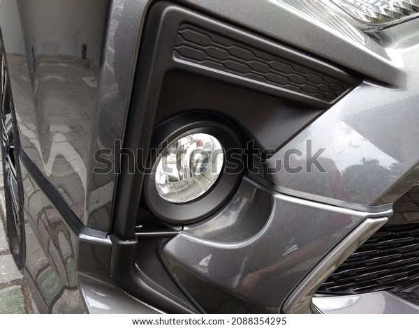Car\
detailing: close up of clean front light\
part