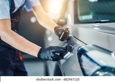 Car Detailing - Man Applies Nano Protective Coating To The Car. Selective Focus.