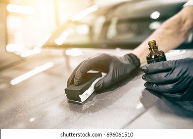 Car Detailing - Man Applies Nano Protective Coating To The Car. Selective Focus.