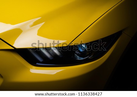 Car detailing series: Clean headlights of yellow sports car
