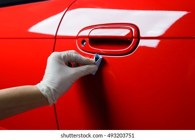 Car Detailing Series : Closeup Of Hand Coating Red Car Door Paint