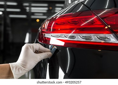 Car Detailing Series : Closeup Of Hand Coating Black Car Paint