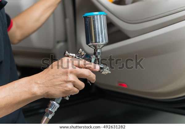 Car detailing series : Closeup of hand coating\
luxury car door panel