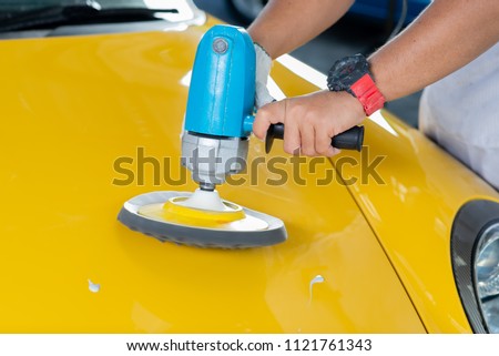 Car detailing series: Polishing yellow sports car hood