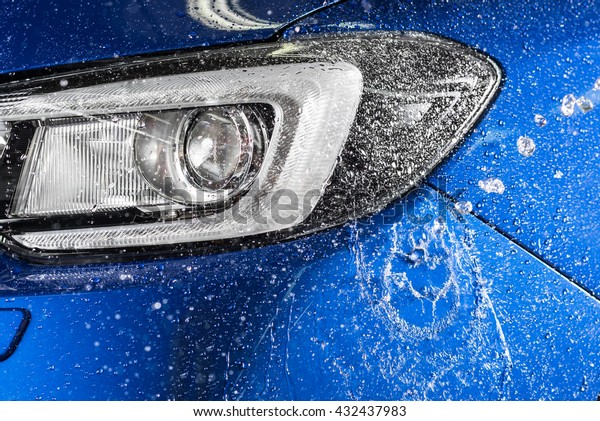 Car\
detailing series : Water splashing on blue car\
bumper