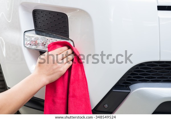 Car detailing\
series : Worker waxing white\
car