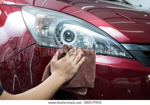 Car detailing\
series : Worker waxing red\
car