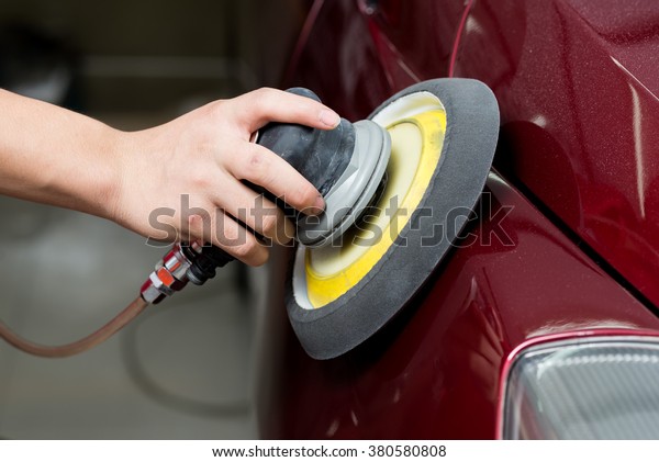 Car detailing\
series : Worker waxing red\
car