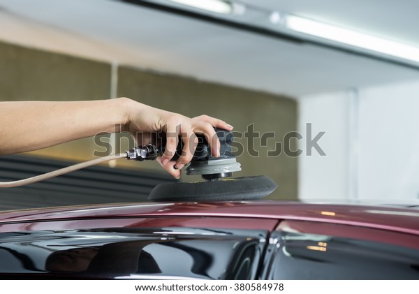 Car detailing
series : Worker waxing red
car