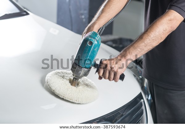 Car detailing\
series : Worker waxing white\
car