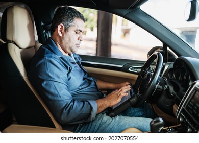 Car Diagnostic. Technical Inspection, Car Electronics. A Latin Man Holds A Digitizing Device.