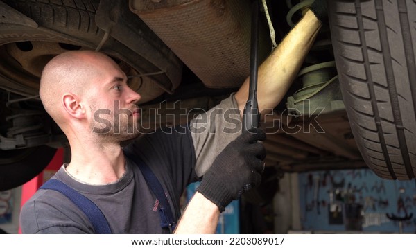 Car diagnostics. an auto mechanic inspects a\
car. auto repair shop.\
breaking
