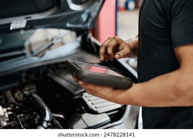 Car, diagnostics and hands of mechanic in workshop for maintenance, repair or service of engine. Auto, expert and inspection with vehicle engineer or technician in garage for transportation closeup - Powered by Shutterstock